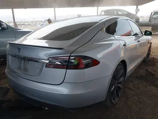 2014 Tesla Model S 60 with VIN 5YJSA1H17EFP35351, listed as a IAAI auction lot 41558434 with 151,002 mi miles and . Bid and sale history available at DreamBid. Image 4.