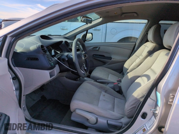 2010 Honda Insight LX with VIN JHMZE2H51AS011243, listed as a Copart auction lot 54445555 with 224,722 mi miles and Salvage Title. Bid and sale history available at DreamBid. Image 7.