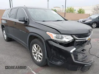 2019 Chevrolet Traverse LS z VIN 1GNERFKW1KJ207291, wystawiony jako IAAI lot #41630111 z przebiegiem 79 596 mil mil oraz . Historia ofert i sprzedaży dostępna na DreamBid. Obrazek 1.