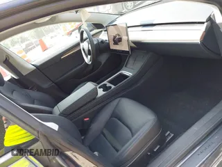 2023 Tesla Model 3 with VIN 5YJ3E1EA2PF566047, listed as a IAAI auction lot 42481008 with 21,143 mi miles and . Bid and sale history available at DreamBid. Image 5.