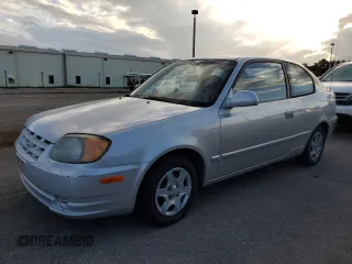 2004 Hyundai Accent GL with VIN KMHCG35C74U312579, listed as a Copart auction lot 75397884 with 0 mi miles and Salvage Title. Bid and sale history available at carsss.com. Image 1.