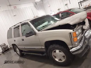 1999 GMC Yukon with VIN 1GKEK13R7XJ723255, listed as a IAAI auction lot 41879617 with 148,324 mi miles. Bid and sale history available at carsss.com. Image 13.