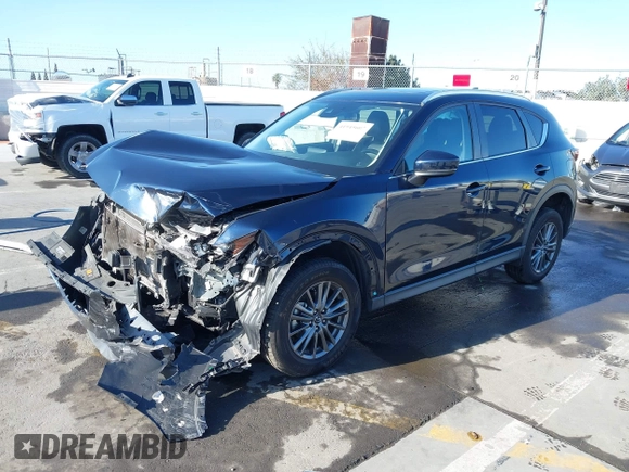2019 Mazda CX-5 Touring with VIN JM3KFACM7K1534905, listed as a IAAI auction lot 41945607 with 56,014 mi miles. Bid and sale history available at carsss.com. Image 2.