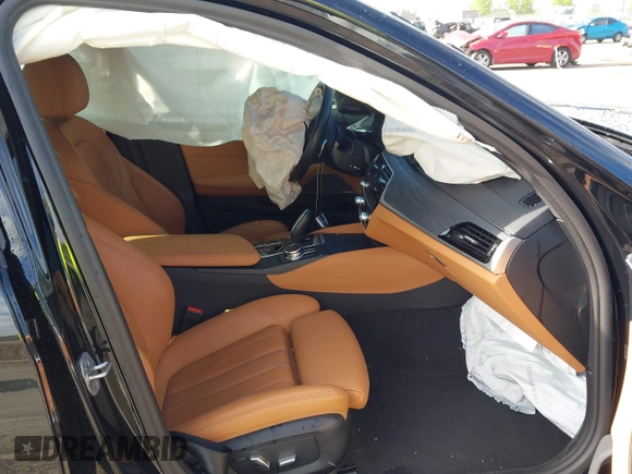 2023 BMW 5 Series 530e with VIN WBA13AG09PCL56556, listed as a IAAI auction lot 42098427 with Not provided miles and . Bid and sale history available at DreamBid. Image 5.