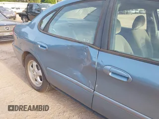 2006 Ford Taurus SE with VIN 1FAFP53U26A179541, listed as a IAAI auction lot 42000612 with 214,881 mi miles. Bid and sale history available at carsss.com. Image 6.