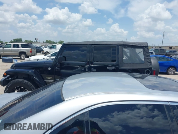 2015 Jeep Wrangler Unlimited Sahara with VIN 1C4HJWEG6FL572674, listed as a IAAI auction lot 42736266 with 97,024 mi miles and . Bid and sale history available at DreamBid. Image 14.
