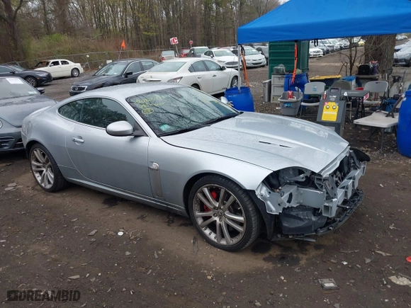 2008 Jaguar XK with VIN SAJWA43C889B21570, listed as a IAAI auction lot 42082547 with 99,783 mi miles. Bid and sale history available at carsss.com. Image 13.