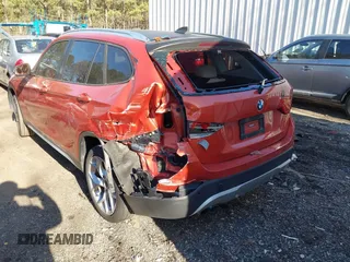 2015 BMW X1 xDrive28i with VIN WBAVL1C58FVY24900, listed as a IAAI auction lot 41772097 with 128,001 mi miles. Bid and sale history available at carsss.com. Image 6.