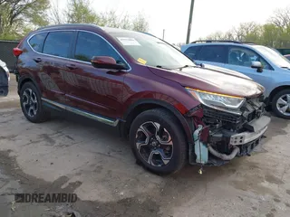 2017 Honda CR-V Touring with VIN 5J6RW2H95HL074264, listed as a IAAI auction lot 41974804 with 94,923 mi miles. Bid and sale history available at carsss.com. Image 1.