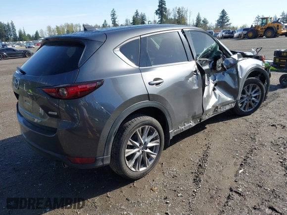 2019 Mazda CX-5 Grand Touring with VIN JM3KFBDM3K1677208, listed as a IAAI auction lot 41929299 with 58,163 mi miles. Bid and sale history available at carsss.com. Image 4.