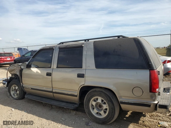 1999 Chevrolet Tahoe with VIN 1GNEC13R6XJ494812, listed as a Copart auction lot 76398254 with 299,584 mi miles and Salvage Title. Bid and sale history available at carsss.com. Image 2.