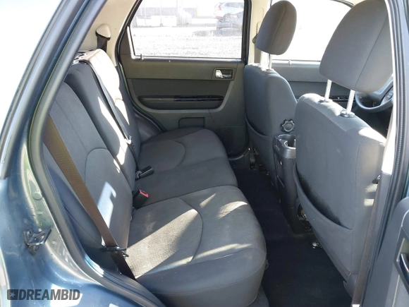 2010 Mazda Tribute Touring with VIN 4F2CY9C73AKM04595, listed as a IAAI auction lot 40797681 with 122,774 mi miles. Bid and sale history available at carsss.com. Image 8.