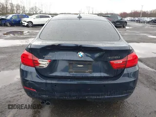 2016 BMW 4 Series 428i xDrive with VIN WBA4C9C59GG137067, listed as a IAAI auction lot 41913733 with 104,378 mi miles and . Bid and sale history available at carsss.com. Image 16.
