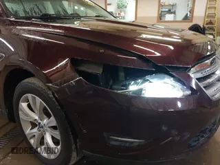 2011 Ford Taurus SEL z VIN 1FAHP2HW5BG141570, wystawiony jako IAAI lot #41867097 z przebiegiem 172 984 mil mil oraz . Historia ofert i sprzedaży dostępna na DreamBid. Obrazek 12.