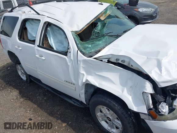 2011 Chevrolet Tahoe LS with VIN 1GNSCAE09BR352496, listed as a IAAI auction lot 41888764 with 234,311 mi miles and . Bid and sale history available at DreamBid. Image 6.