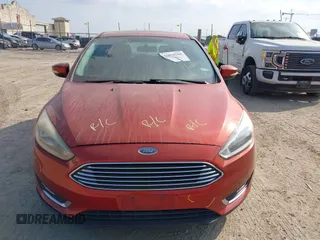 2018 Ford Focus Titanium z VIN 1FADP3N24JL313938, wystawiony jako IAAI lot #42050701 z przebiegiem 162 859 mil mil oraz . Historia ofert i sprzedaży dostępna na DreamBid. Obrazek 13.