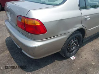 2000 Honda Civic EX z VIN 1HGEJ8647YL033973, wystawiony jako IAAI lot #42465298 z przebiegiem 116 154 mil mil oraz . Historia ofert i sprzedaży dostępna na DreamBid. Obrazek 6.