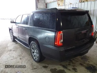 2015 GMC Yukon XL SLT with VIN 1GKS2HKC6FR667110, listed as a IAAI auction lot 41472250 with 141,383 mi miles. Bid and sale history available at carsss.com. Image 3.
