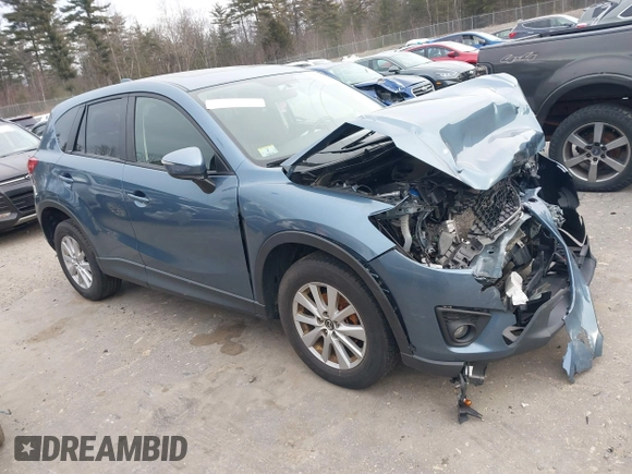 2015 Mazda CX-5 Touring with VIN JM3KE4CY1F0545305, listed as a IAAI auction lot 41234599 with 92,791 mi miles. Bid and sale history available at carsss.com. Image 1.