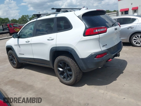 2014 Jeep Cherokee Trailhawk with VIN 1C4PJMBS5EW231448, listed as a IAAI auction lot 42632143 with 97,461 mi miles and . Bid and sale history available at DreamBid. Image 3.