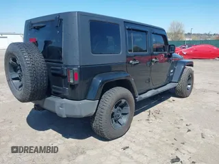 2010 Jeep Wrangler Unlimited Sahara with VIN 1J4HA5H17AL140941, listed as a IAAI auction lot 42004203 with 126,100 mi miles. Bid and sale history available at carsss.com. Image 4.