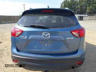 2015 Mazda CX-5 Grand Touring with VIN JM3KE4DY5F0469098, listed as a IAAI auction lot 41858792 with 174,883 mi miles. Bid and sale history available at carsss.com. Image 17.