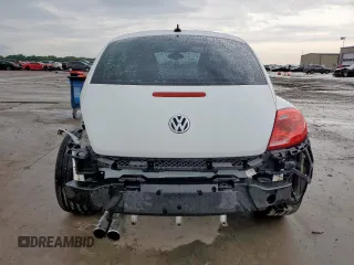 2014 Volkswagen Beetle 1.8T z VIN 3VWJ17AT5EM652990, wystawiony jako Copart lot #60094715 z przebiegiem 109 911 mil mil oraz Szkoda całkowita • Salvage title. Historia ofert i sprzedaży dostępna na DreamBid. Obrazek 6.