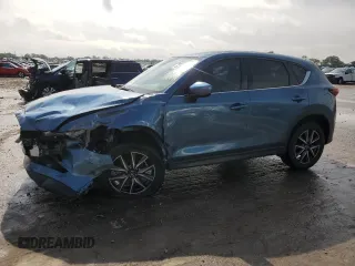 2018 Mazda CX-5 Grand Touring z VIN JM3KFBDM8J0325049, wystawiony jako Copart lot #57075125 z przebiegiem 117 239 mil mil oraz Szkody całkowita. Historia ofert i sprzedaży dostępna na DreamBid. Obrazek 1.