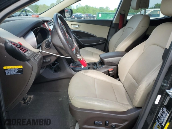 2017 Hyundai Santa Fe 2.4L z VIN 5XYZUDLB1HG412675, wystawiony jako Copart lot #57169045 z przebiegiem 38 947 mil mil oraz Szkoda całkowita • Salvage title. Historia ofert i sprzedaży dostępna na DreamBid. Obrazek 7.
