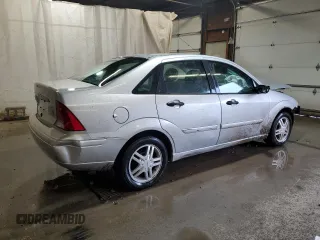 2003 Ford Focus SE z VIN 1FAFP34P43W186633, wystawiony jako Copart lot #56899065 z przebiegiem Nie podano mil oraz Szkoda całkowita • Salvage title. Historia ofert i sprzedaży dostępna na DreamBid. Obrazek 3.