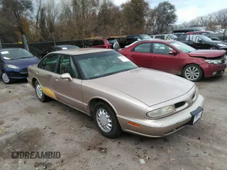 1999 Oldsmobile 88 LS z VIN 1G3HN52K0X4823577, wystawiony jako IAAI lot #35120460 z przebiegiem 172 515 mil mil oraz . Historia ofert i sprzedaży dostępna na DreamBid. Obrazek 1.