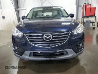 2016 Mazda CX-5 Grand Touring with VIN JM3KE4DY0G0826687, listed as a Copart auction lot 50886975 with 130,493 mi miles and Salvage Title. Bid and sale history available at carsss.com. Image 5.
