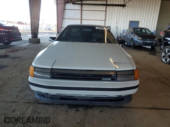 1986 Toyota Celica z VIN JT2ST64CXG7013064, wystawiony jako Copart lot #44228575 z przebiegiem 101 881 mil mil oraz Szkoda całkowita • Salvage title. Historia ofert i sprzedaży dostępna na DreamBid. Obrazek 5.
