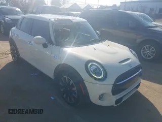 2021 MINI Hardtop 4 Door Cooper S with VIN WMWXU9C00M2P04693, listed as a IAAI auction lot 41785185 with 57,848 mi miles and . Bid and sale history available at DreamBid. Image 1.