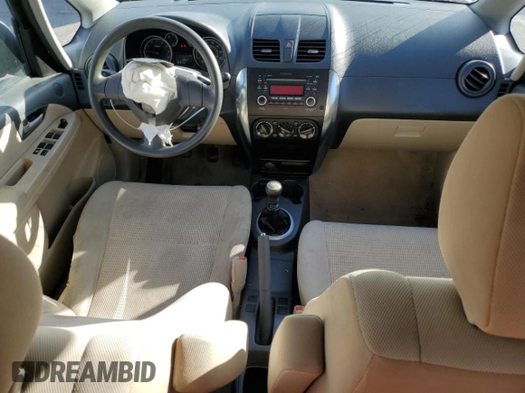 2011 Suzuki SX4 LE with VIN JS2YC5A21B6300207, listed as a Copart auction lot 77040354 with 162,915 mi miles and Salvage Title. Bid and sale history available at carsss.com. Image 8.