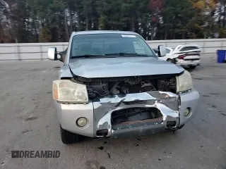 2005 Nissan Titan SE with VIN 1N6BA06B45N539629, listed as a Copart auction lot 82527074 with 154,255 mi miles and Salvage title. Bid and sale history available at DreamBid. Image 11.