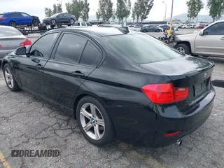 2014 BMW 3 Series 320i with VIN WBA3B1G57ENS80800, listed as a IAAI auction lot 42097683 with 152,924 mi miles. Bid and sale history available at carsss.com. Image 3.