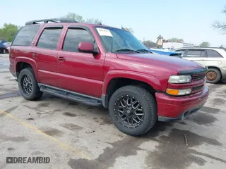2005 Chevrolet Tahoe LT with VIN 1GNEK13T05R236749, listed as a IAAI auction lot 42070371 with 215,428 mi miles. Bid and sale history available at carsss.com. Image 1.