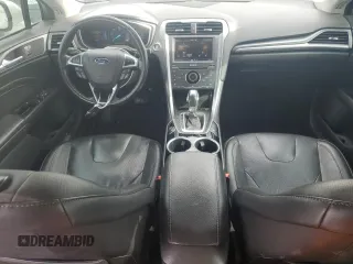 2013 Ford Fusion Titanium Hybrid с VIN 3FA6P0RU3DR282013, выставлен на аукционе Copart как лот 53651595 с пробегом 133 214 миль миль и Списание • Salvage title. История ставок и продаж доступна на DreamBid. Изображение 8.