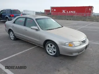 2002 Mazda 626 LX with VIN 1YVGF22DX25263864, listed as a IAAI auction lot 41846129 with 282,516 mi miles. Bid and sale history available at carsss.com. Image 1.