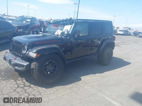 2022 Jeep Wrangler Unlimited Rubicon with VIN 1C4HJXFN0NW242903, listed as a IAAI auction lot 41448636 with 28,007 mi miles and . Bid and sale history available at DreamBid. Image 2.