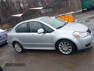 2011 Suzuki SX4 with VIN JS2YC5A41B6300385, listed as a IAAI auction lot 41570810 with 117,847 mi miles and . Bid and sale history available at DreamBid. Image 13.