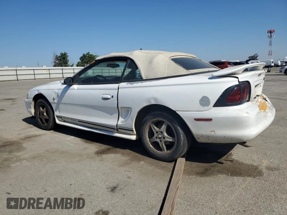 1998 Ford Mustang with VIN 1FAFP4448WF269580, listed as a Copart auction lot 54861155 with 304,869 mi miles and Salvage title. Bid and sale history available at DreamBid. Image 2.