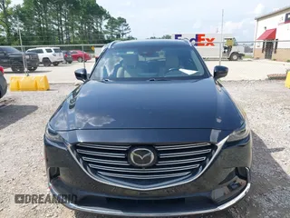 2022 Mazda CX-9 Grand Touring with VIN JM3TCBDYXN0627657, listed as a IAAI auction lot 42498856 with 61,044 mi miles and . Bid and sale history available at DreamBid. Image 12.
