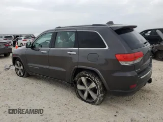 2014 Jeep Grand Cherokee Overland with VIN 1C4RJFCG9EC572237, listed as a Copart auction lot 53864865 with 90,657 mi miles and Salvage Title. Bid and sale history available at DreamBid. Image 2.