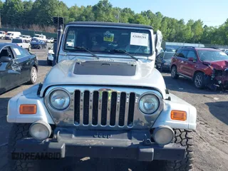 2005 Jeep Wrangler Unlimited with VIN 1J4FA44S55P352803, listed as a IAAI auction lot 42688284 with 128,586 mi miles and . Bid and sale history available at DreamBid. Image 12.