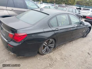 2015 BMW 7 Series 750i xDrive with VIN WBAYB6C57FD965802, listed as a IAAI auction lot 40588698 with 999,999 mi miles. Bid and sale history available at carsss.com. Image 4.