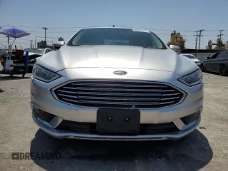 2018 Ford Fusion SE z VIN 3FA6P0LU8JR110693, wystawiony jako Copart lot #61931995 z przebiegiem 119 629 mil mil oraz Szkoda całkowita • Salvage title. Historia ofert i sprzedaży dostępna na DreamBid. Obrazek 5.