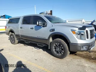 2016 Nissan Titan XD PRO-4X with VIN 1N6BA1F4XGN509643, listed as a Copart auction lot 74530434 with 83,734 mi miles and Clean Title. Bid and sale history available at carsss.com. Image 4.