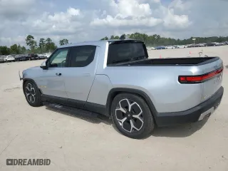 2023 Rivian R1T Adventure with VIN 7FCTGAAA1PN020612, listed as a Copart auction lot 72971044 with 7,858 mi miles and Salvage Title. Bid and sale history available at carsss.com. Image 2.